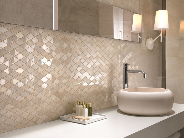 White tile shower with brass fixtures